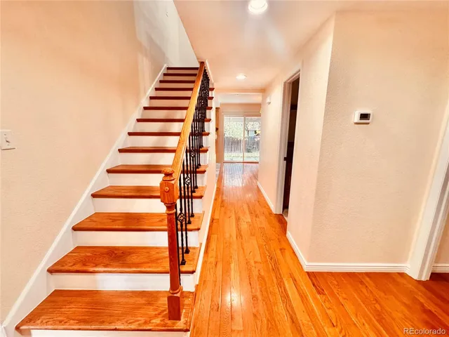 a view of entryway with wooden floor