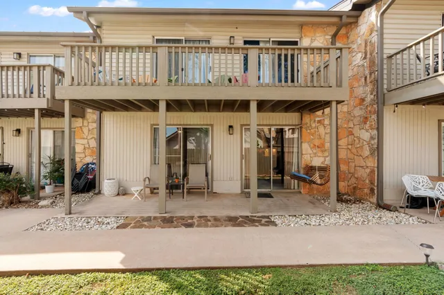 a view of a backyard with sitting area