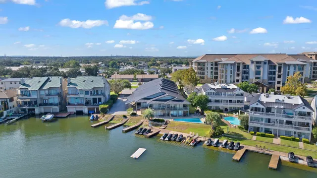 a swimming pool with outdoor seating and yard
