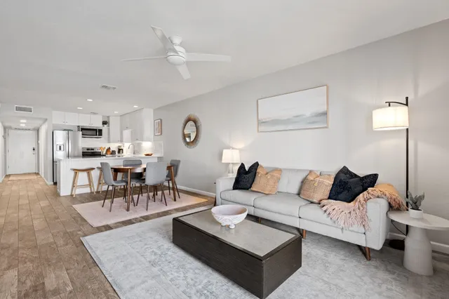 a living room with furniture and a table