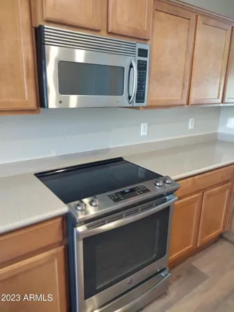 a stove top oven sitting inside of a kitchen
