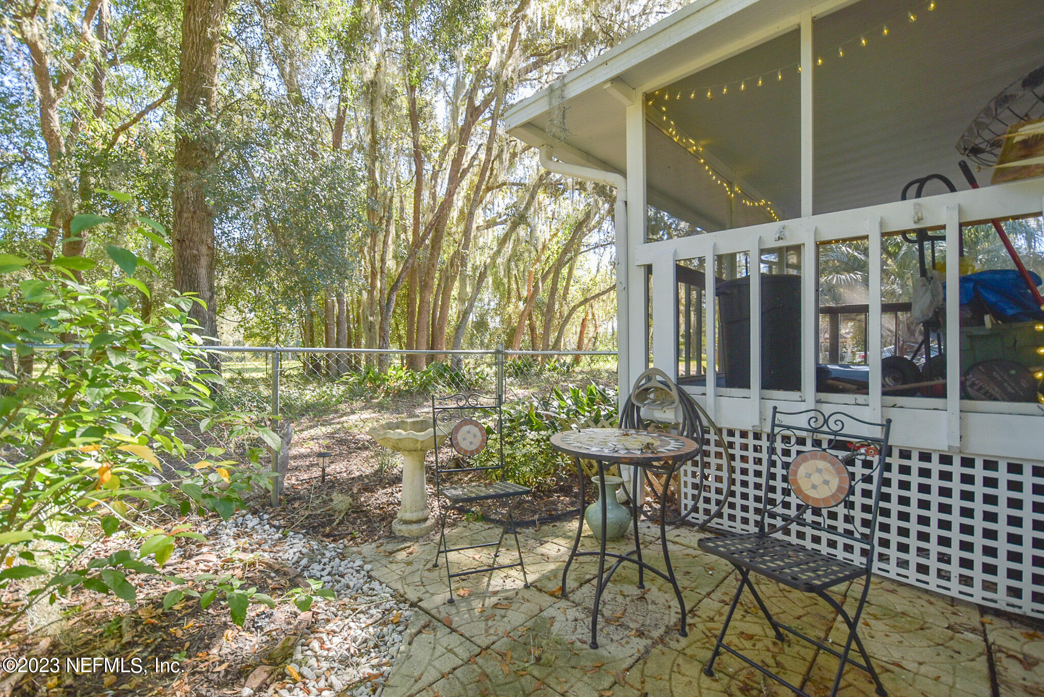 136 Lawrence Lane Georgetown, FL 32139 - Photo 23 of 33 a view of a chair and table in a patio