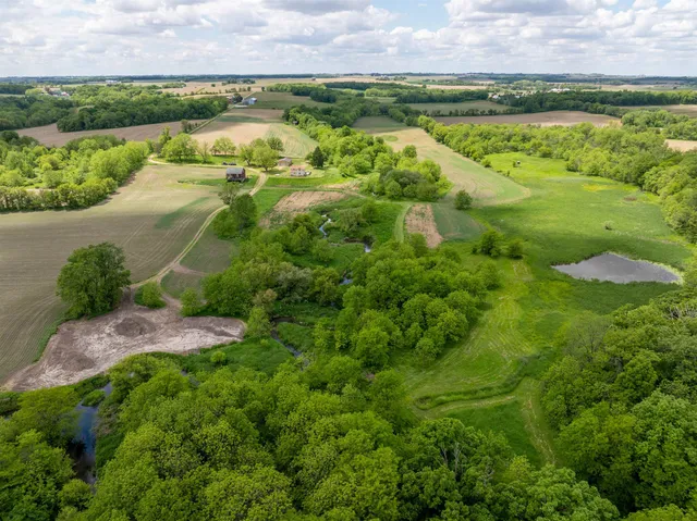 a view of a garden with a lake view