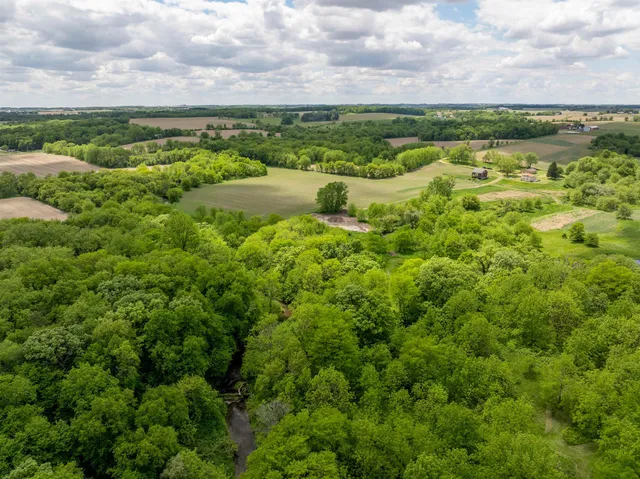 an aerial view of a garden with houses
