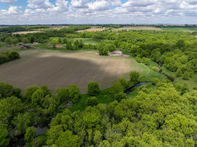 a view of a house with wooden fence