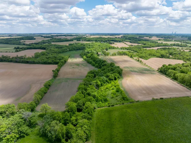 a view of a lake with houses in the back