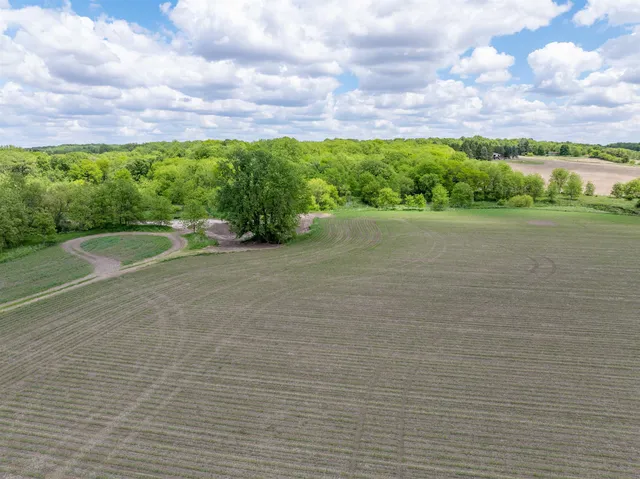 a kitchen with stainless steel appliances granite countertop a sink window and cabinets