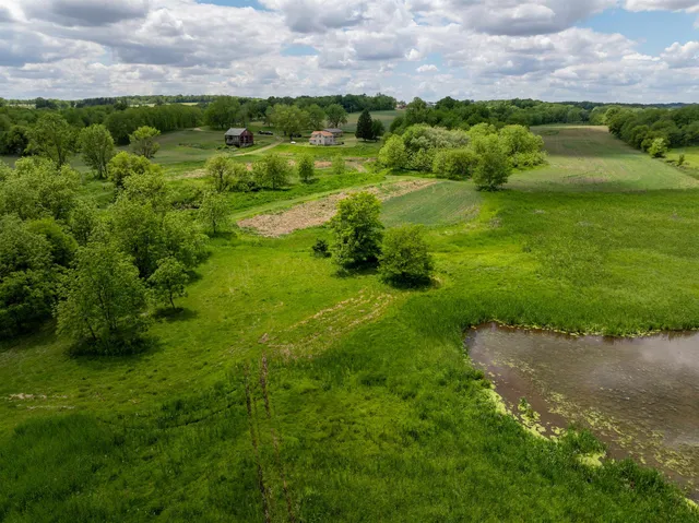 a view of a room with gym equipment and a window