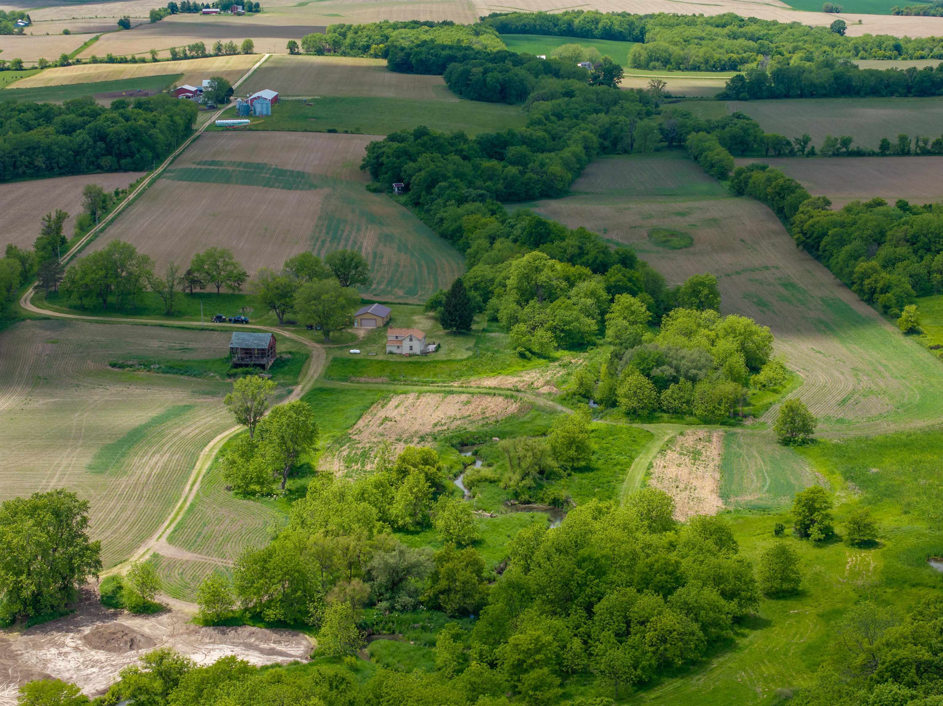 10385 North Rock City Road Leaf River, IL 61047 - Photo 40 of 99 an aerial view of a residential houses with outdoor space and trees all around