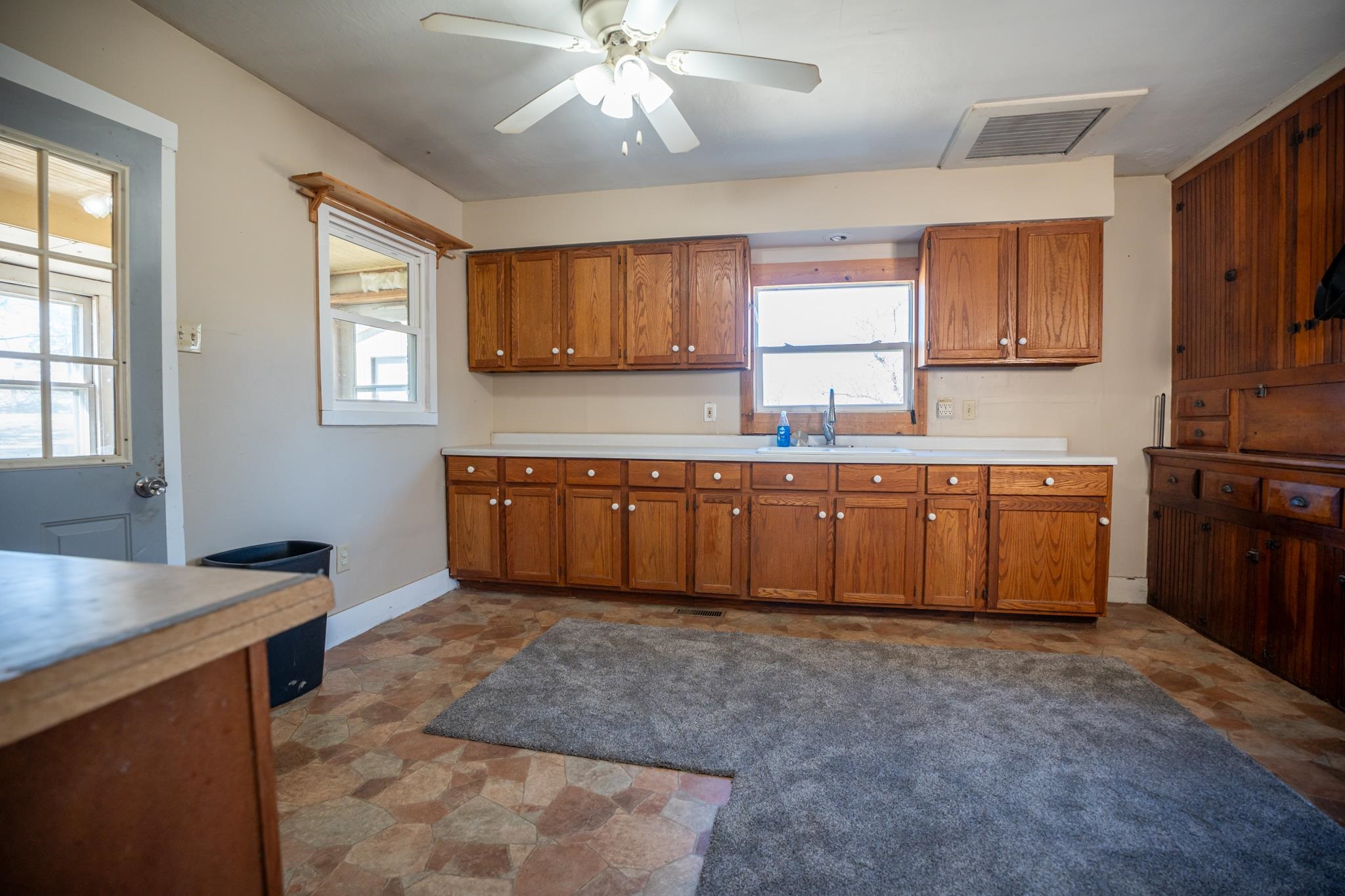 10385 North Rock City Road Leaf River, IL 61047 - Photo 46 of 99 a large kitchen with a large window and stainless steel appliances