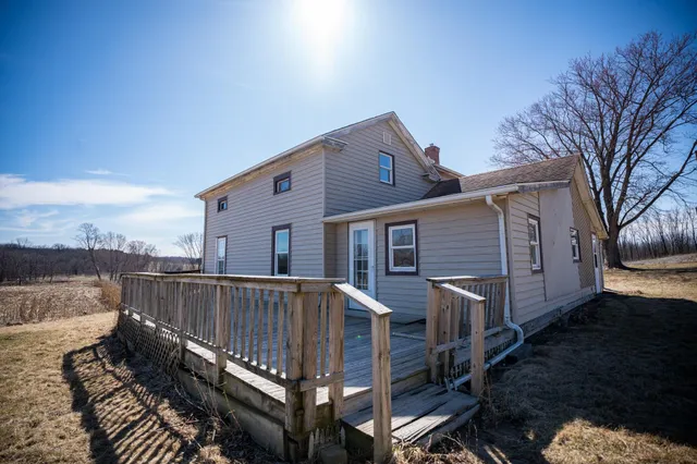 a view of empty room with wooden ceiling