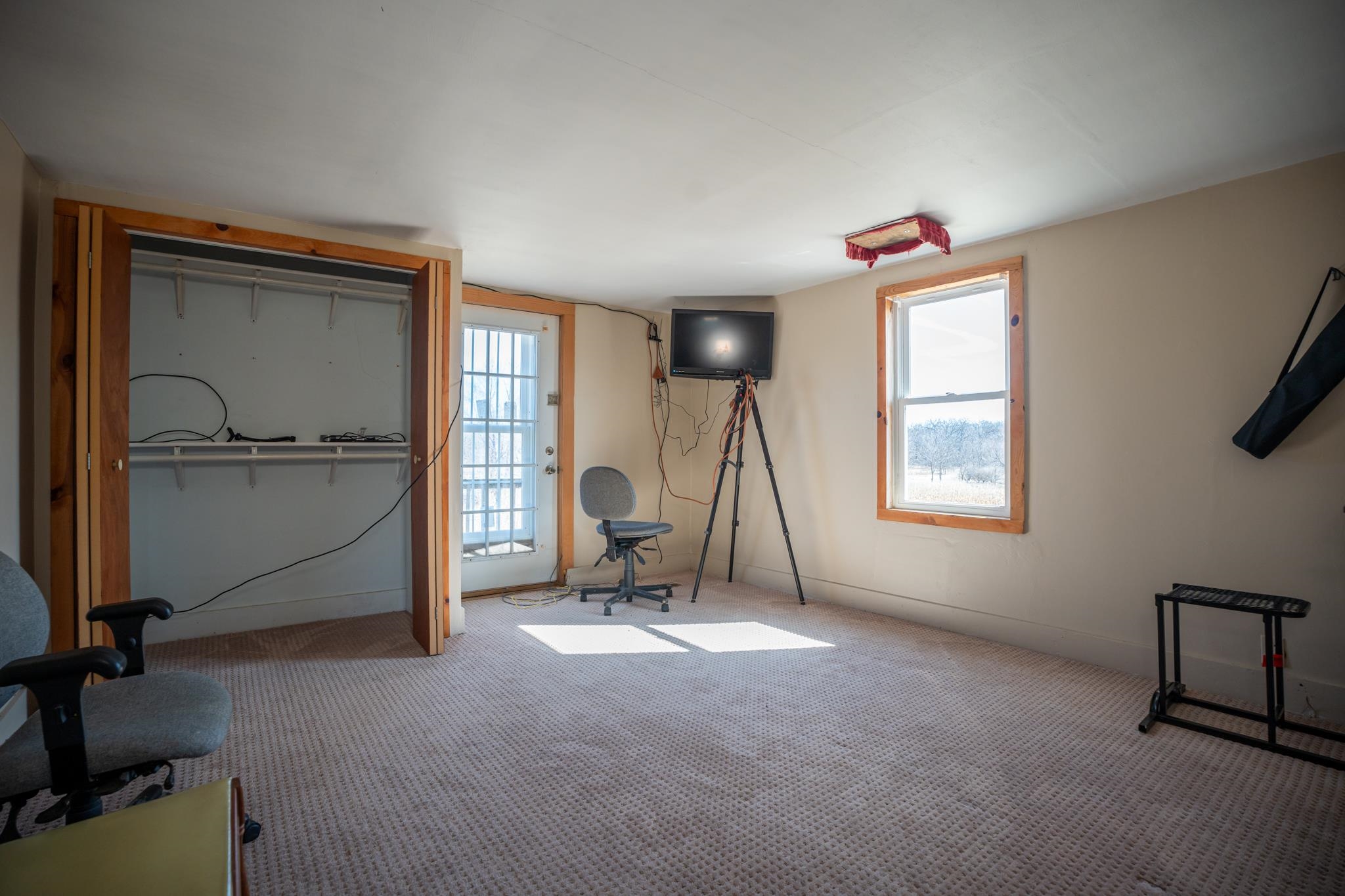 10385 North Rock City Road Leaf River, IL 61047 - Photo 51 of 99 a view of a room with gym equipment and a window