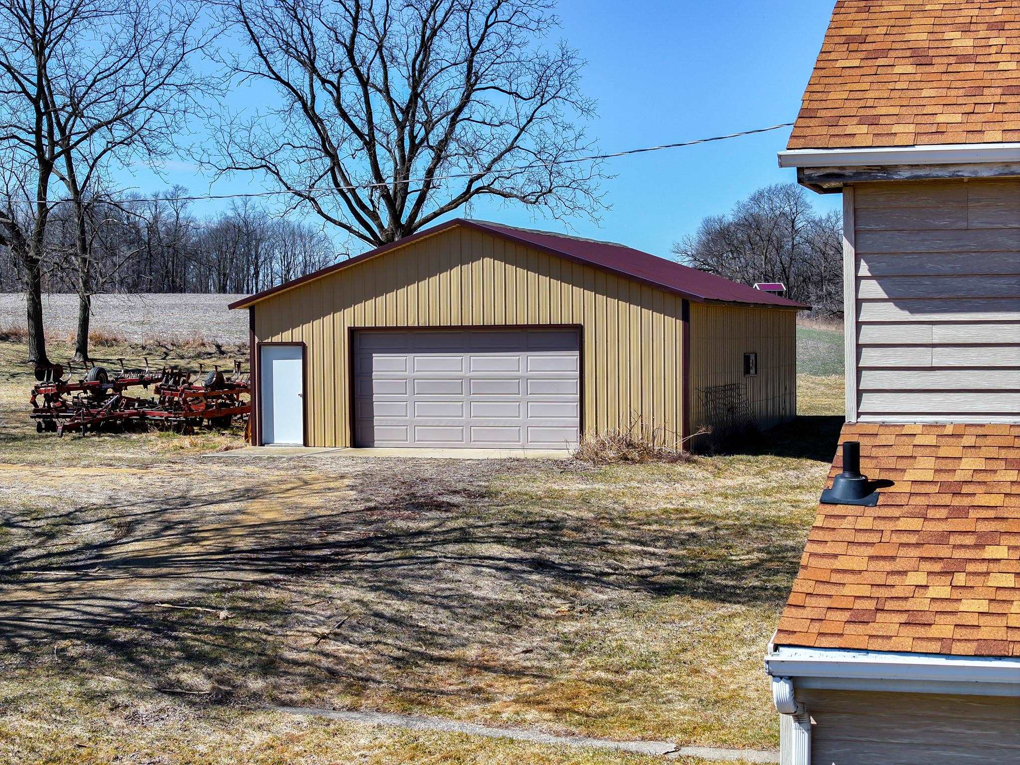 10385 North Rock City Road Leaf River, IL 61047 - Photo 66 of 99 a front view of a house with a yard
