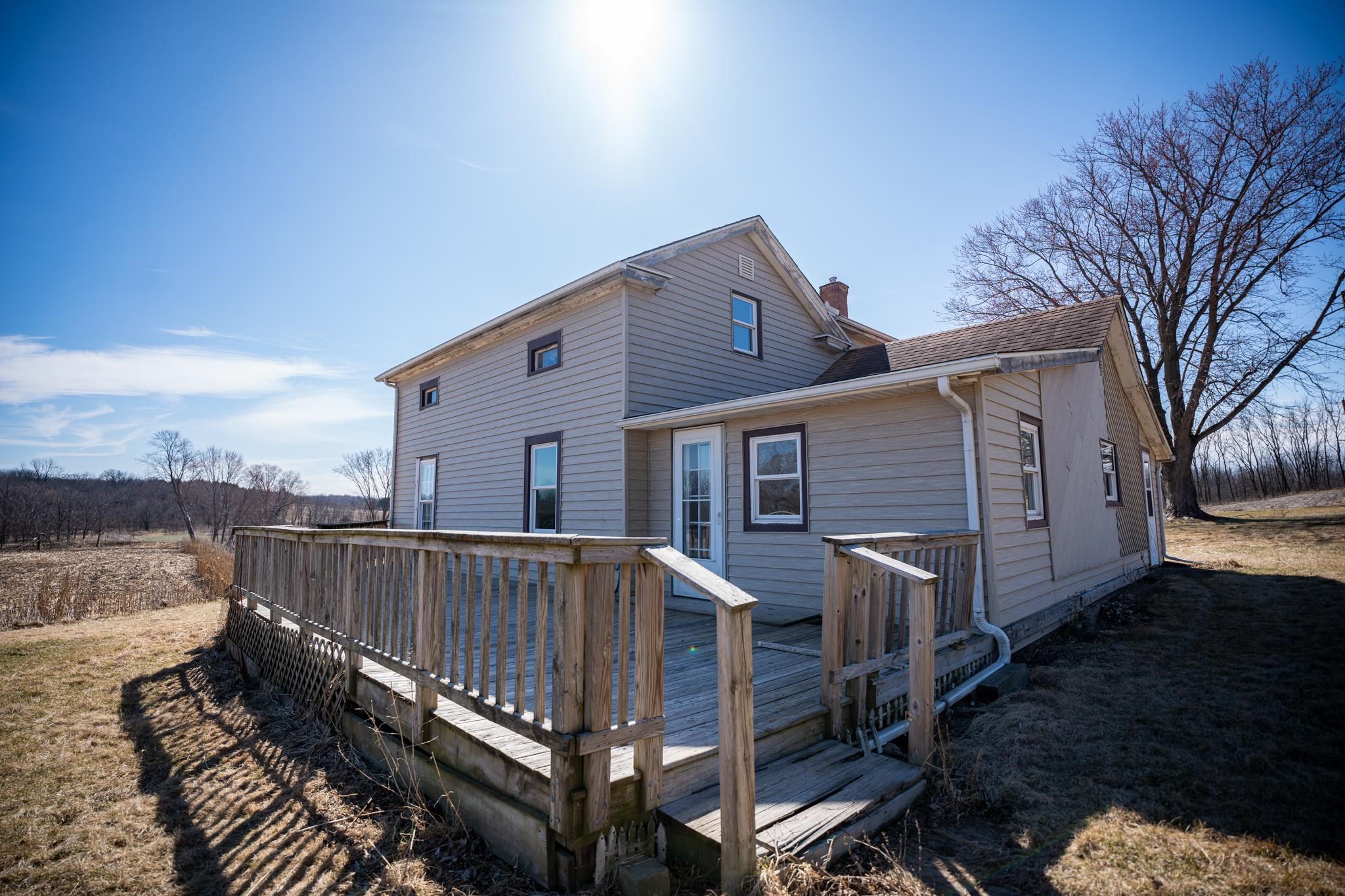 10385 North Rock City Road Leaf River, IL 61047 - Photo 7 of 99 a view of a house with a roof deck