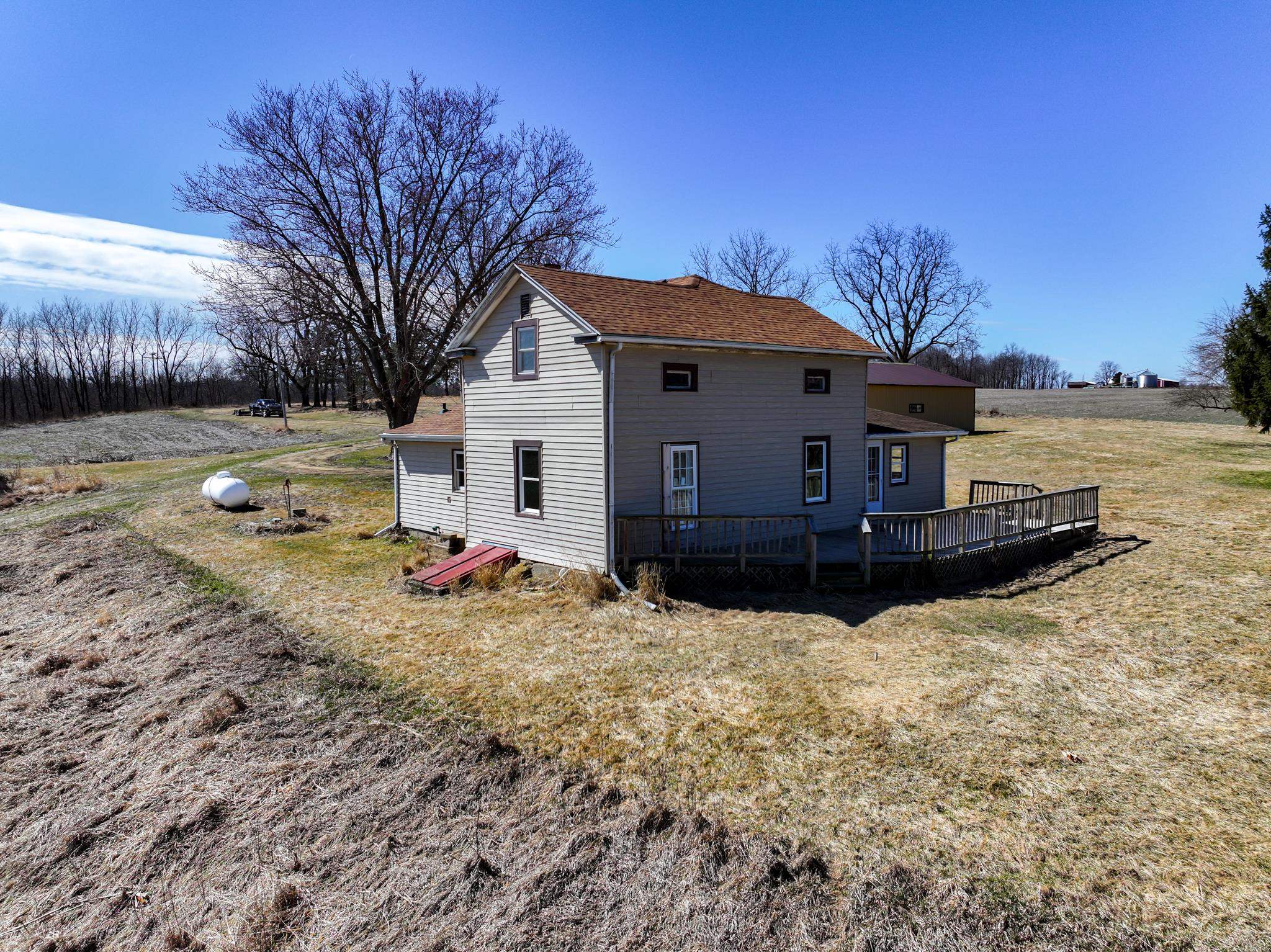 10385 North Rock City Road Leaf River, IL 61047 - Photo 10 of 99 a view of a house with a yard covered in snow