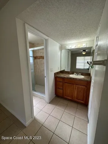 a kitchen with a sink a counter top space and cabinets