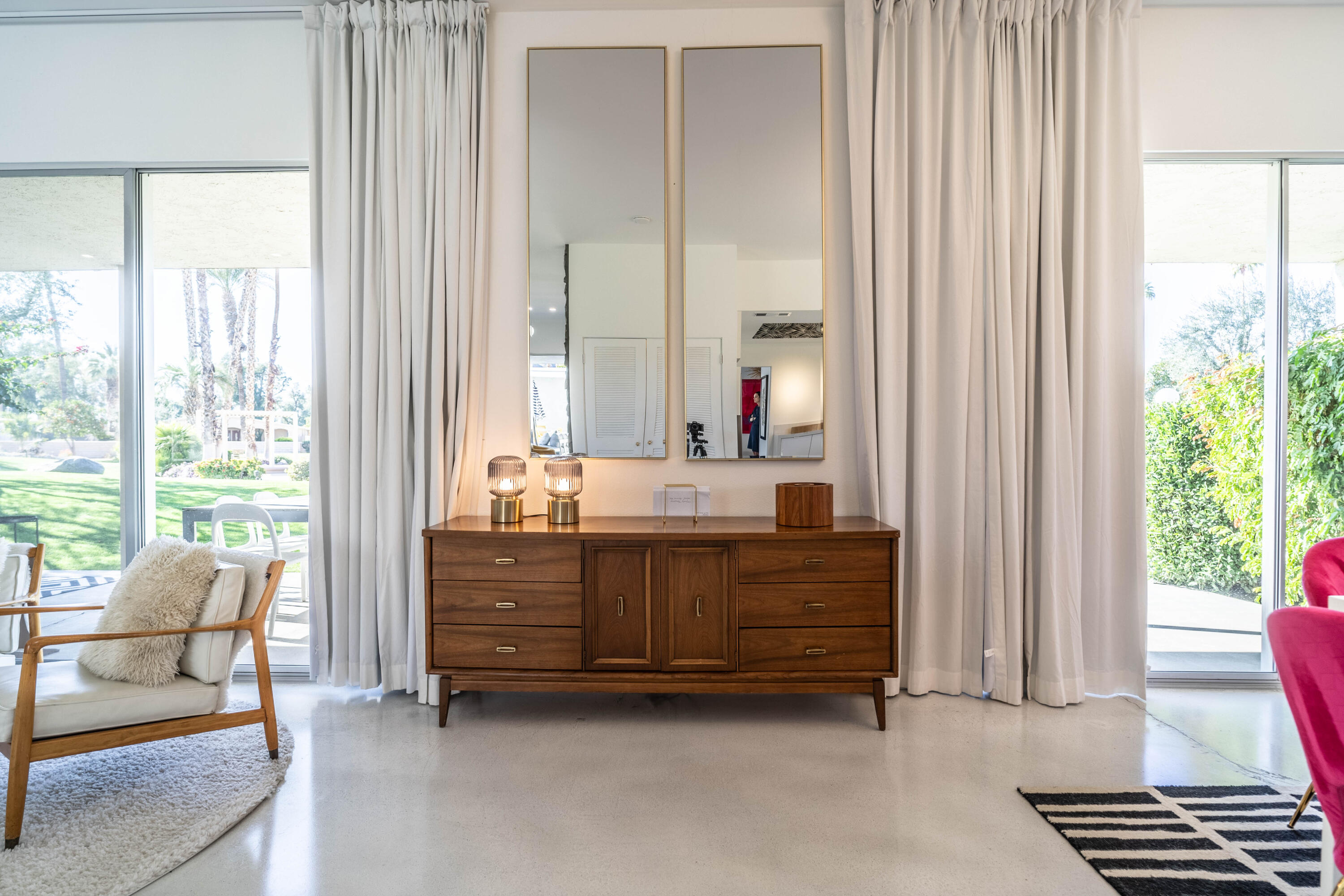 45705 Pawnee Road Indian Wells, CA 92210 - Photo 13 of 59 a room with furniture and a dresser next to a window