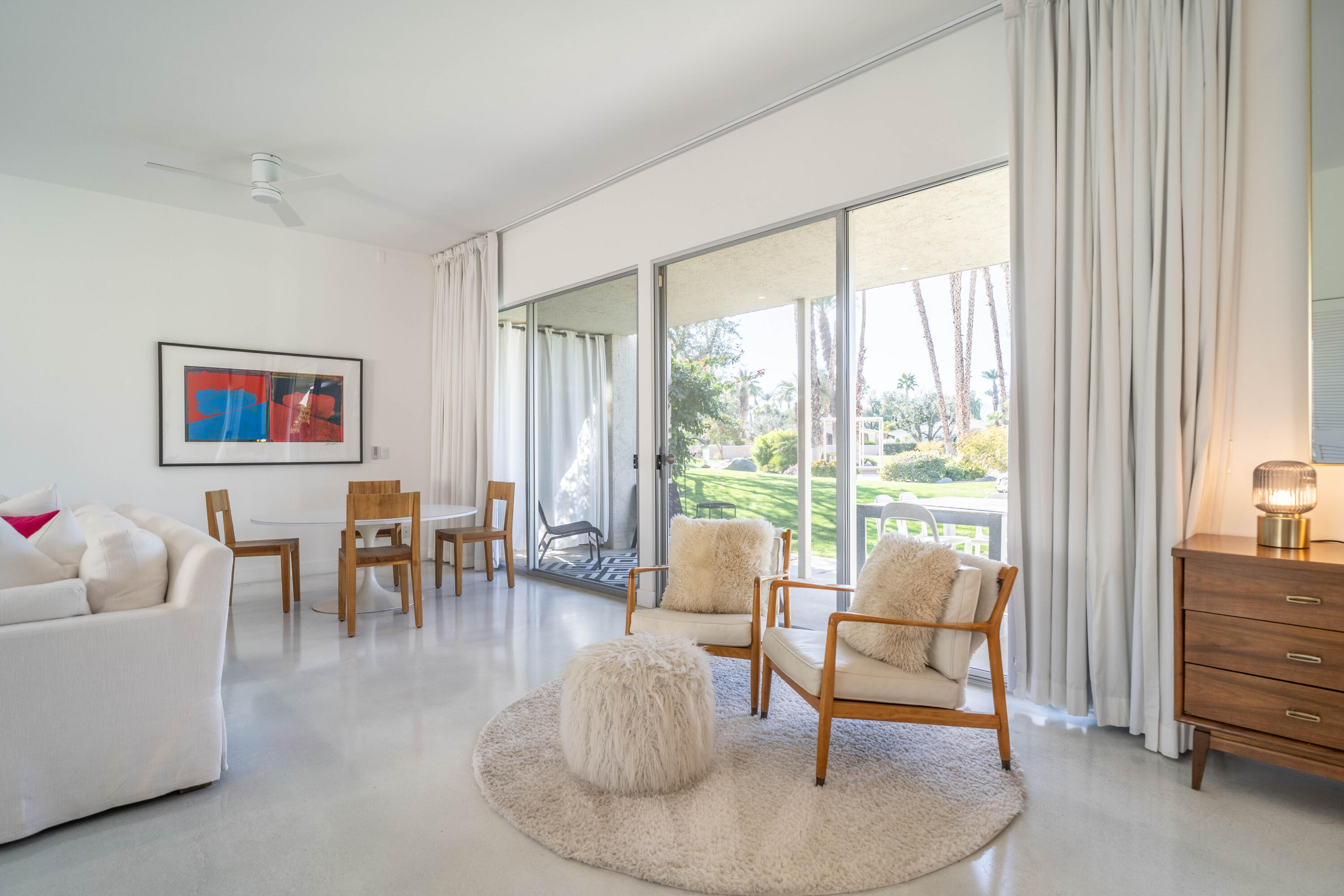 45705 Pawnee Road Indian Wells, CA 92210 - Photo 17 of 59 a living room with furniture and a floor to ceiling window