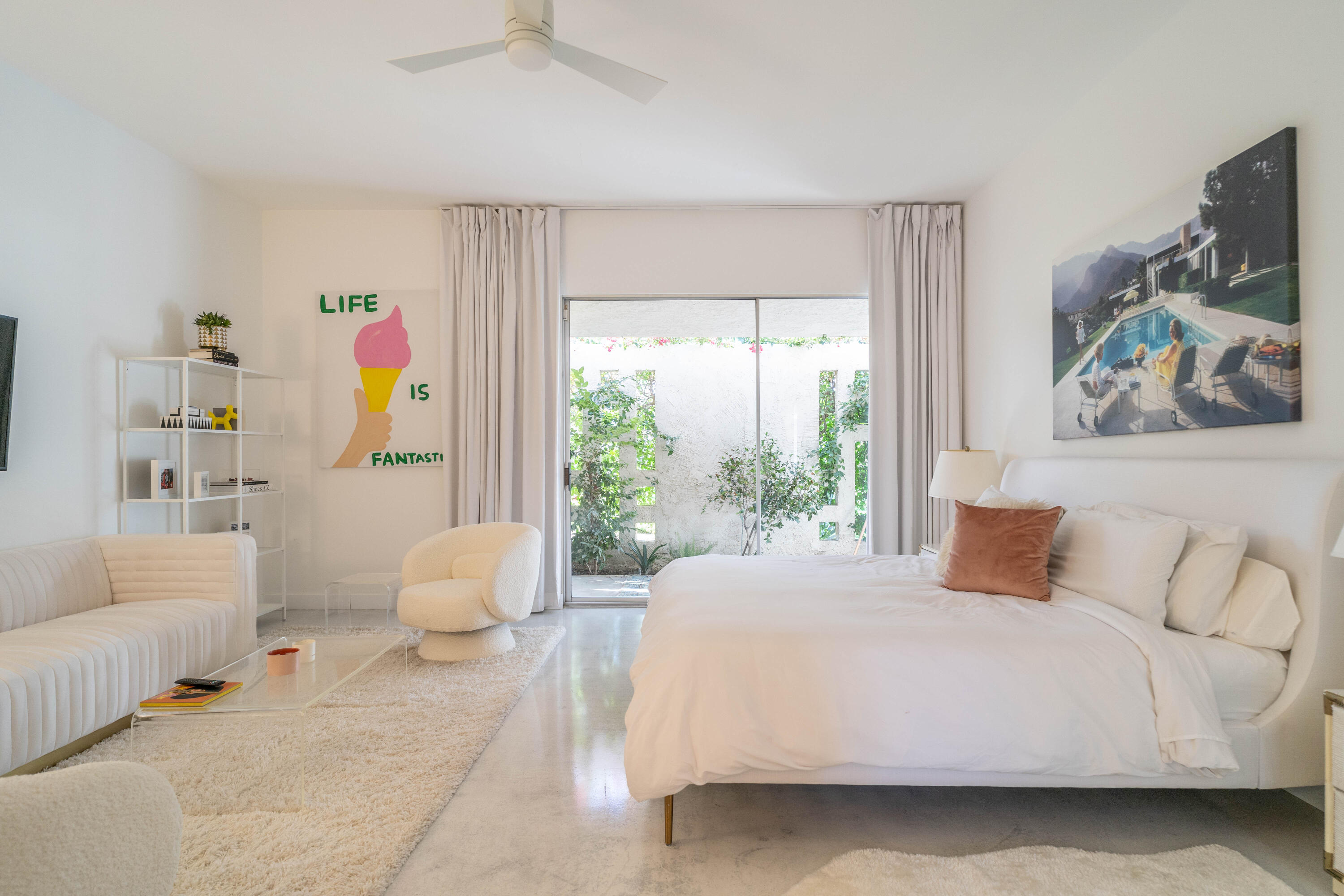 45705 Pawnee Road Indian Wells, CA 92210 - Photo 25 of 59 a bedroom with a bed and a large window