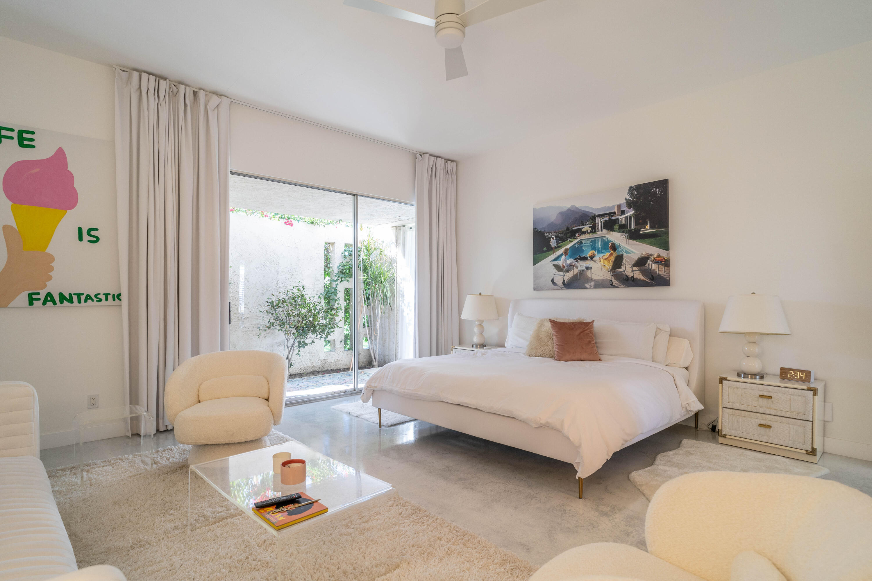 45705 Pawnee Road Indian Wells, CA 92210 - Photo 27 of 59 a bedroom with a bed and a large window