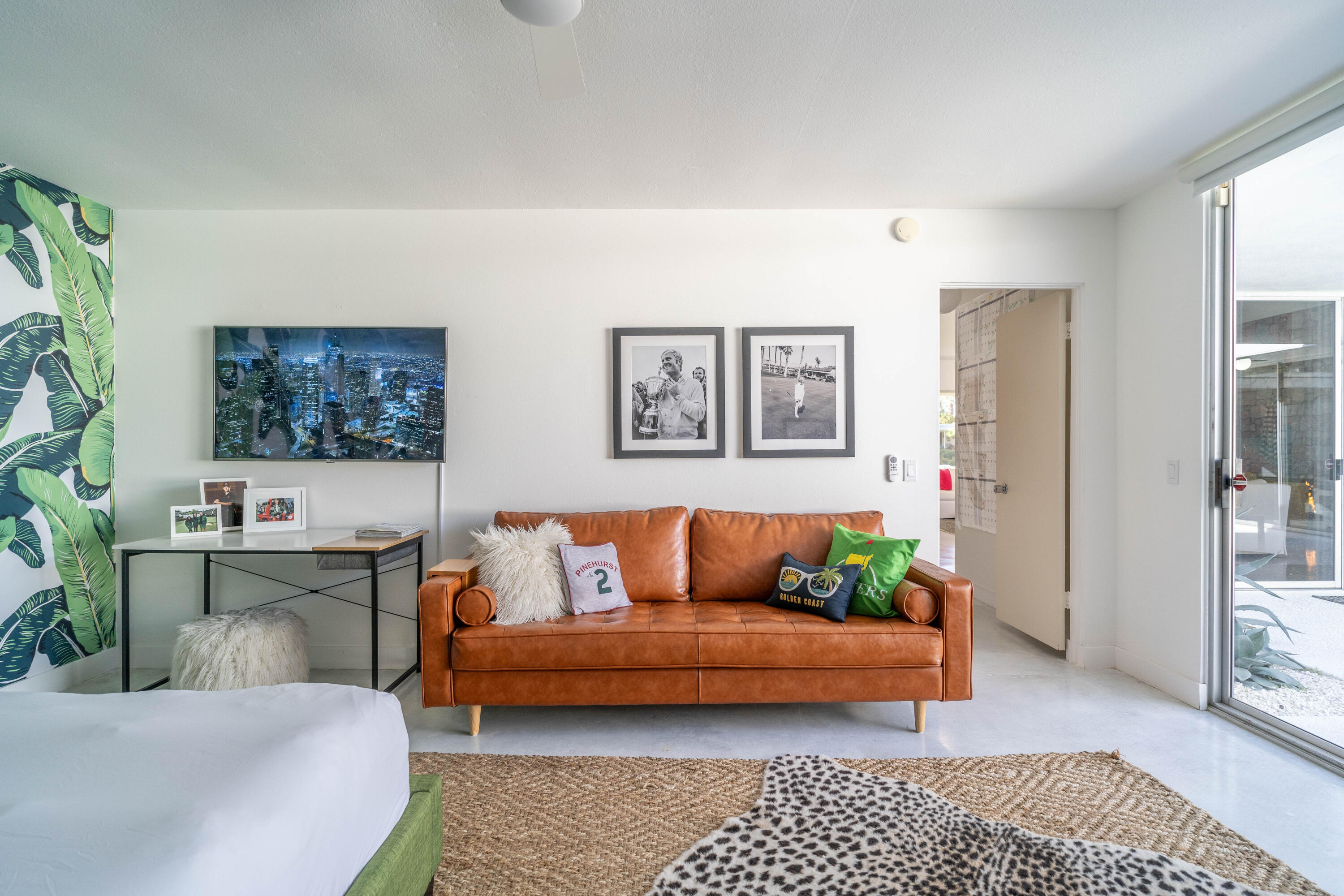 45705 Pawnee Road Indian Wells, CA 92210 - Photo 36 of 59 a living room with furniture a rug and a painting on the wall