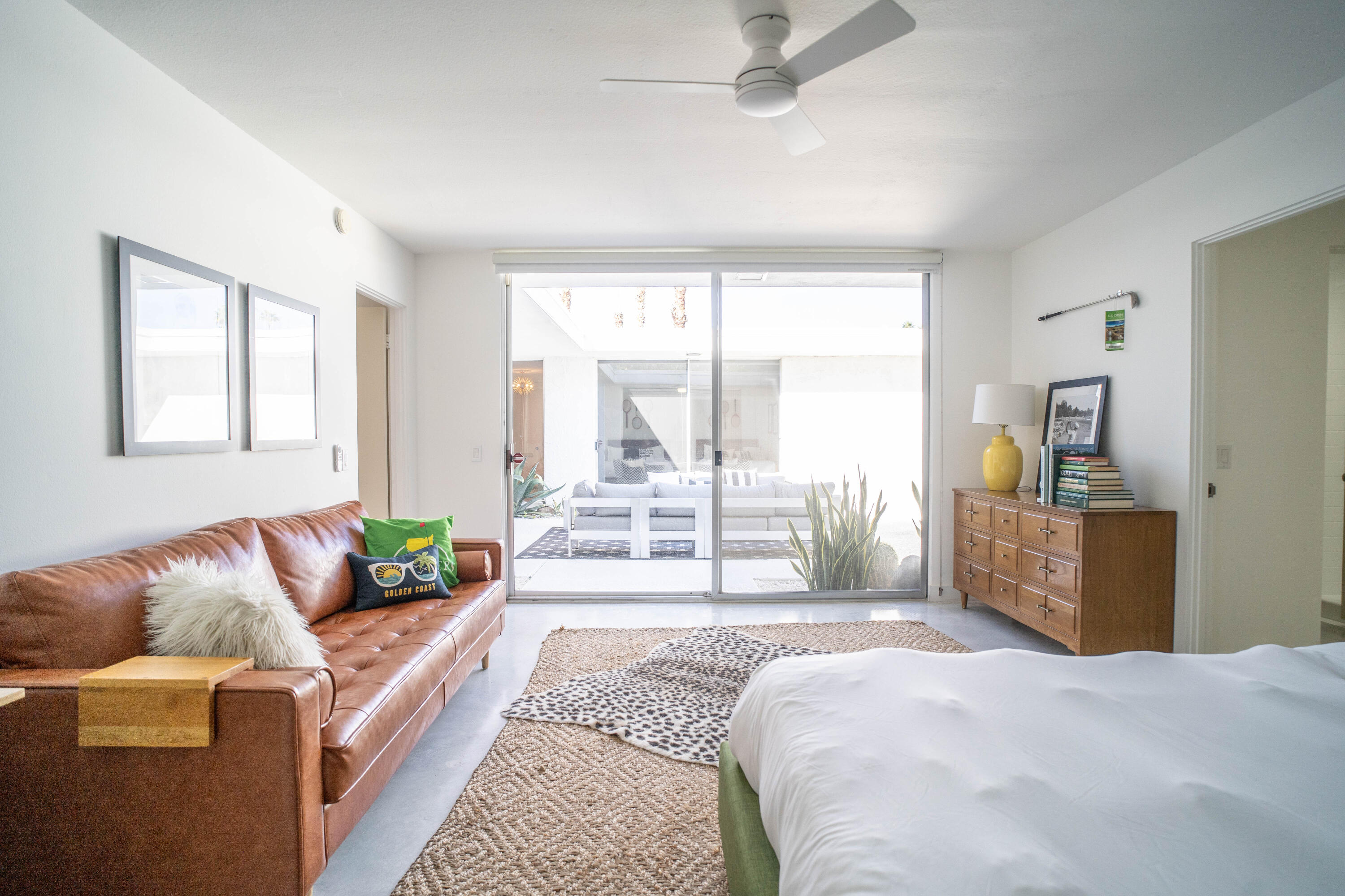 45705 Pawnee Road Indian Wells, CA 92210 - Photo 37 of 59 a bedroom with a large bed couch and a window