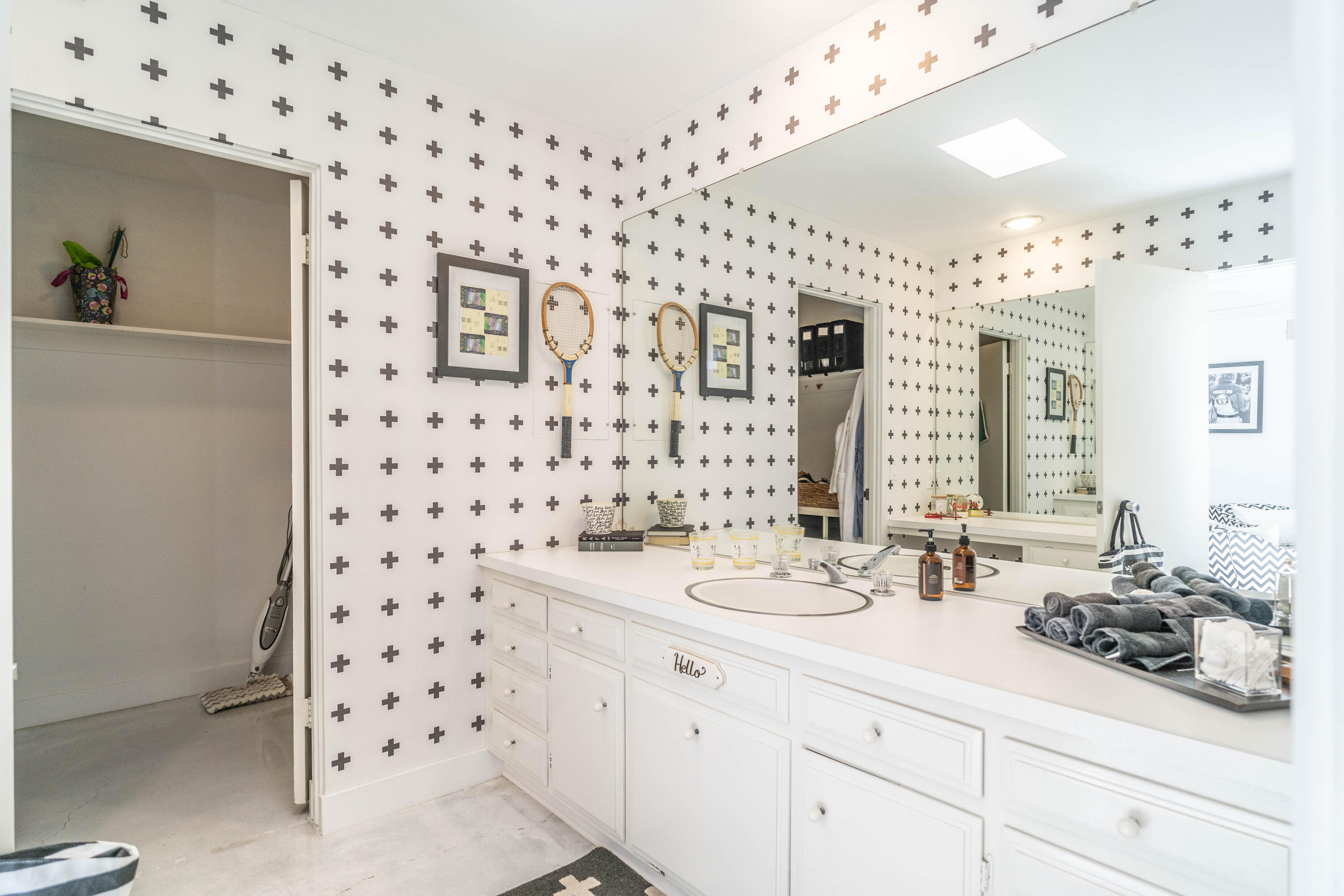 45705 Pawnee Road Indian Wells, CA 92210 - Photo 43 of 59 a bathroom with a sink a vanity and a mirror