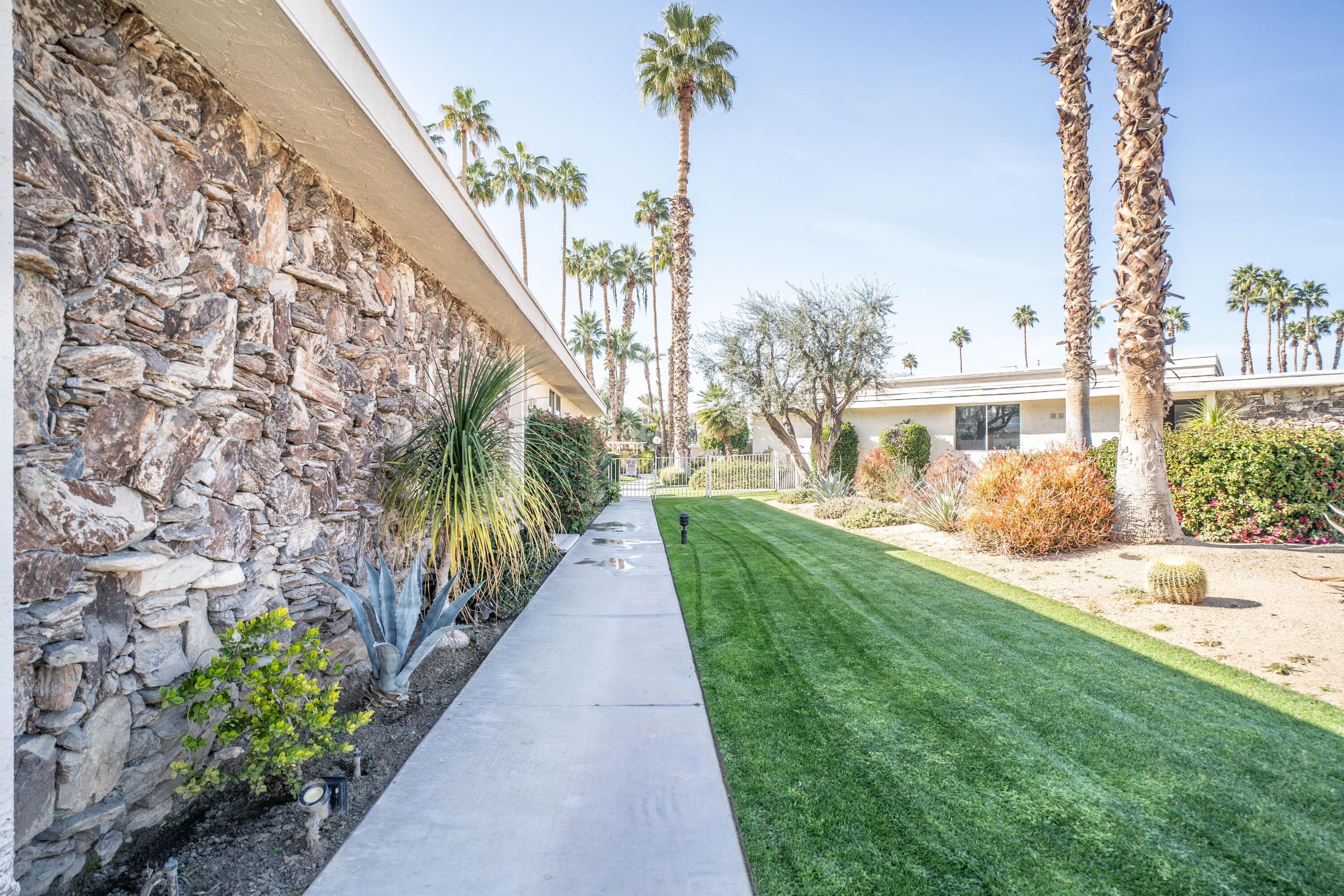 45705 Pawnee Road Indian Wells, CA 92210 - Photo 52 of 59 a view of a house with a yard and pathway