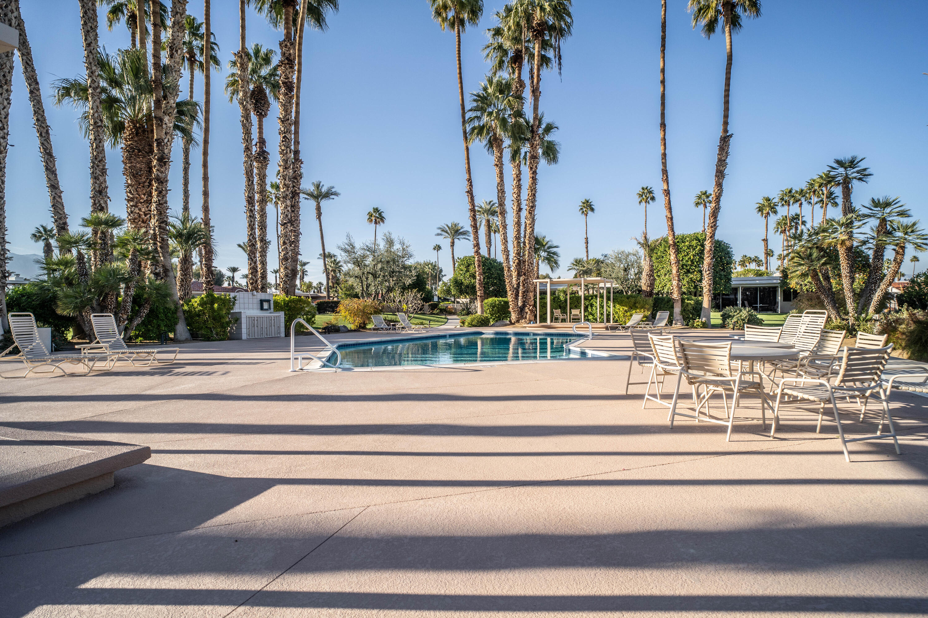 45705 Pawnee Road Indian Wells, CA 92210 - Photo 55 of 59 a view of multi story residential apartment building with a palm tree in front of it