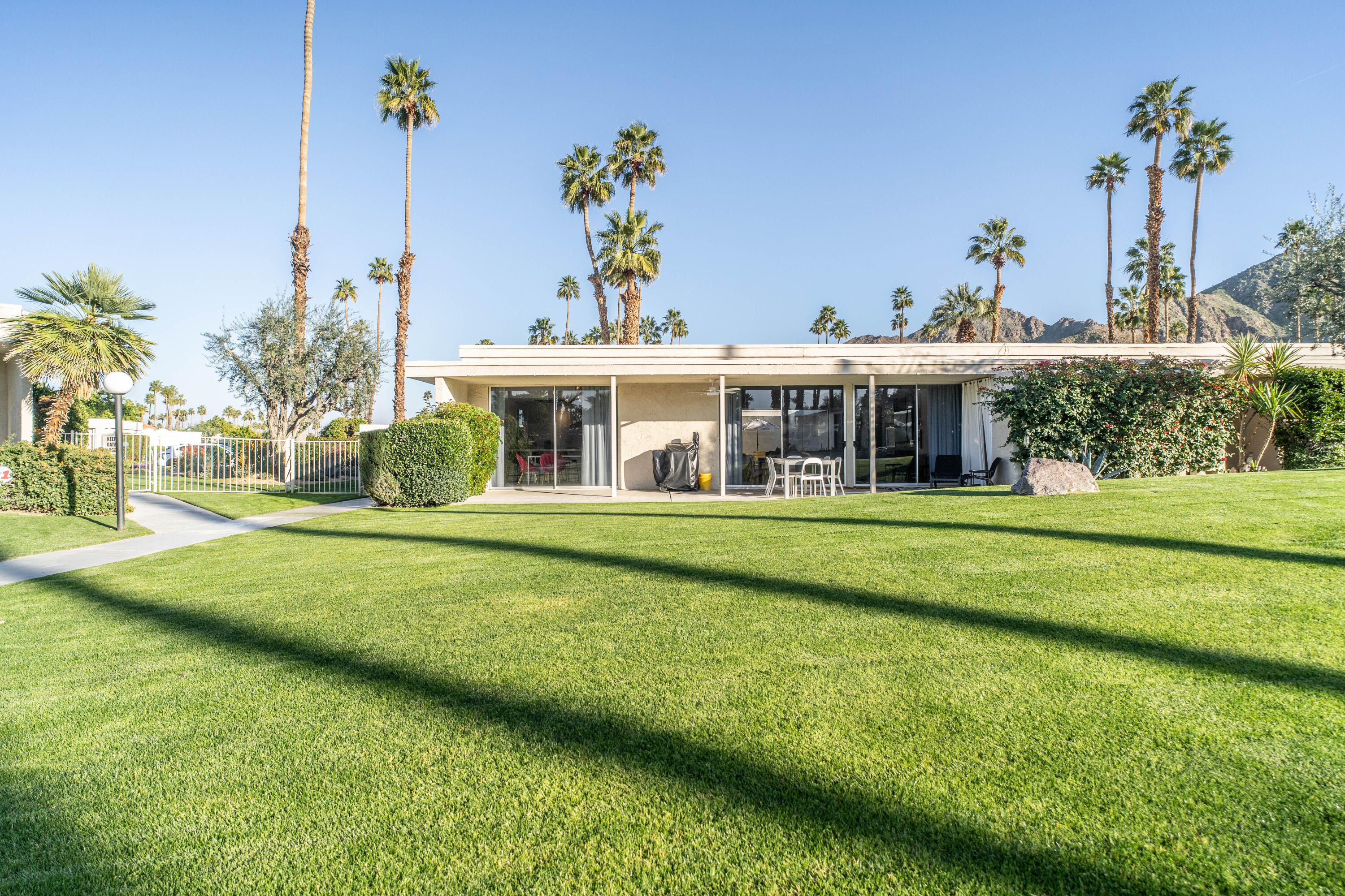45705 Pawnee Road Indian Wells, CA 92210 - Photo 58 of 59 a view of a house with a yard table and chairs