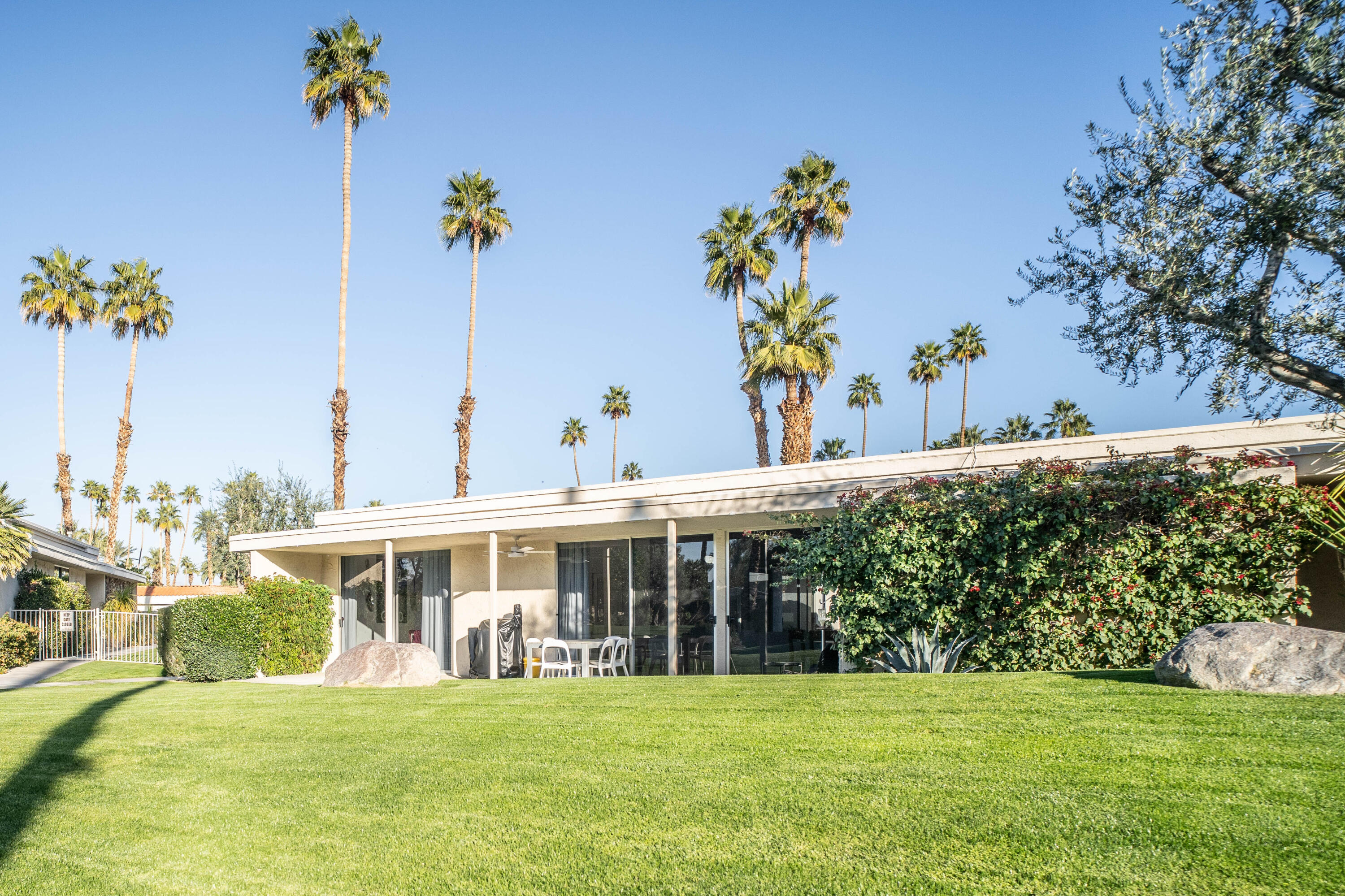 45705 Pawnee Road Indian Wells, CA 92210 - Photo 59 of 59 a front view of a house with a garden