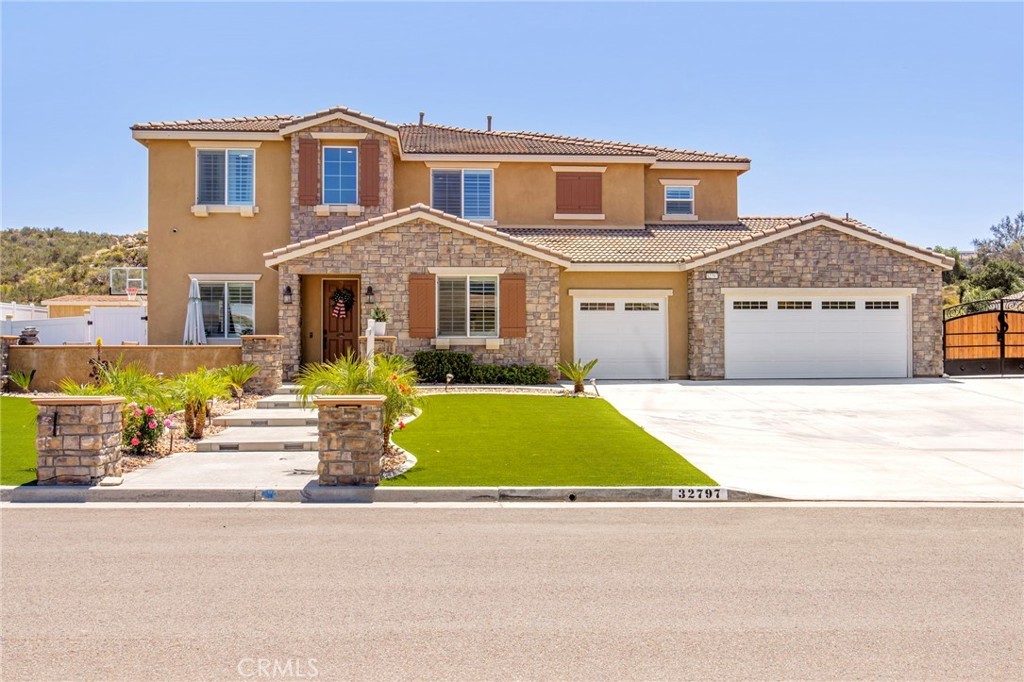 32797 Hayden Road Menifee, CA 92584 - Photo 3 of 51 a front view of a house with a yard and garage