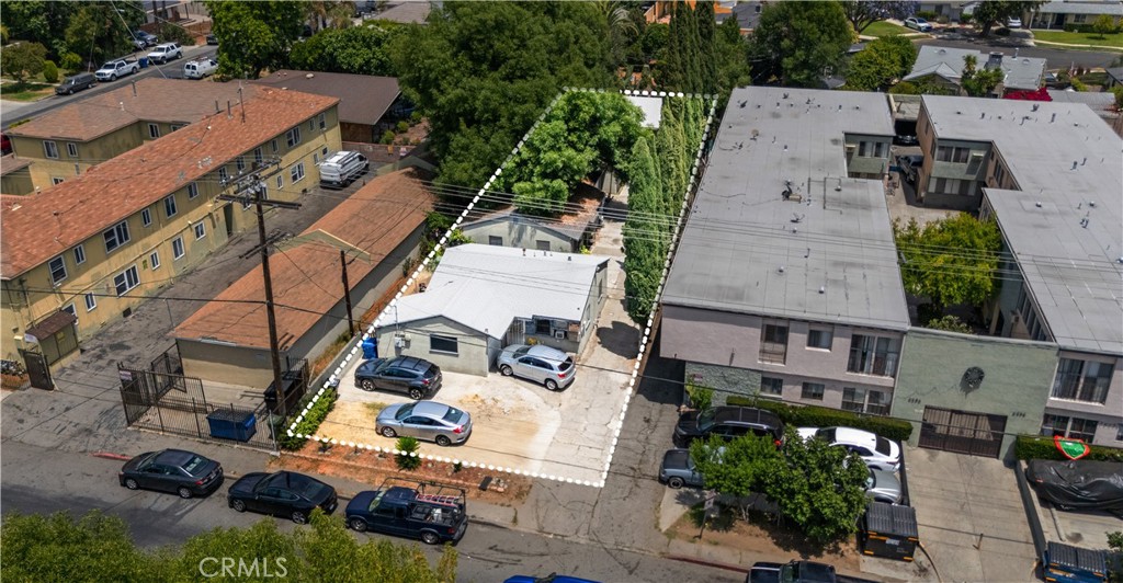 an aerial view of multiple houses with yard