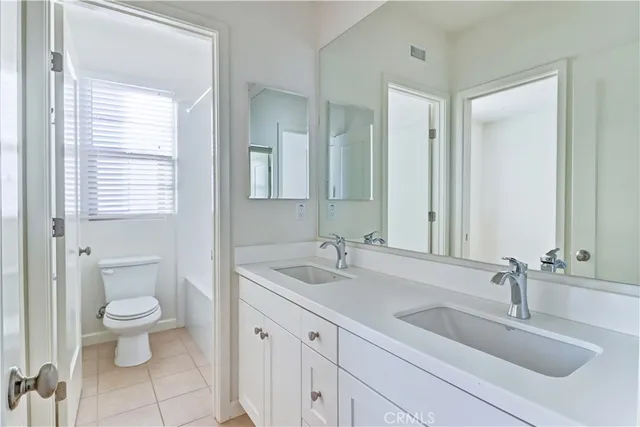 a white bath tub sitting next to a white toilet