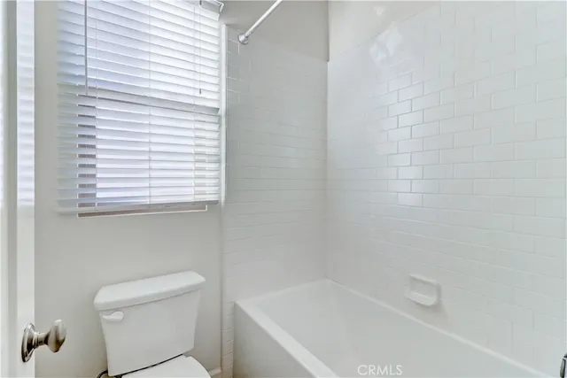 a bathroom with double sink and a mirror