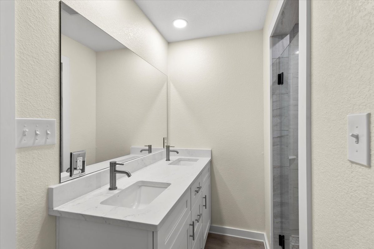 412 Oak Street Bastrop, TX 78602 - Photo 12 of 25 a bathroom with a sink and a mirror