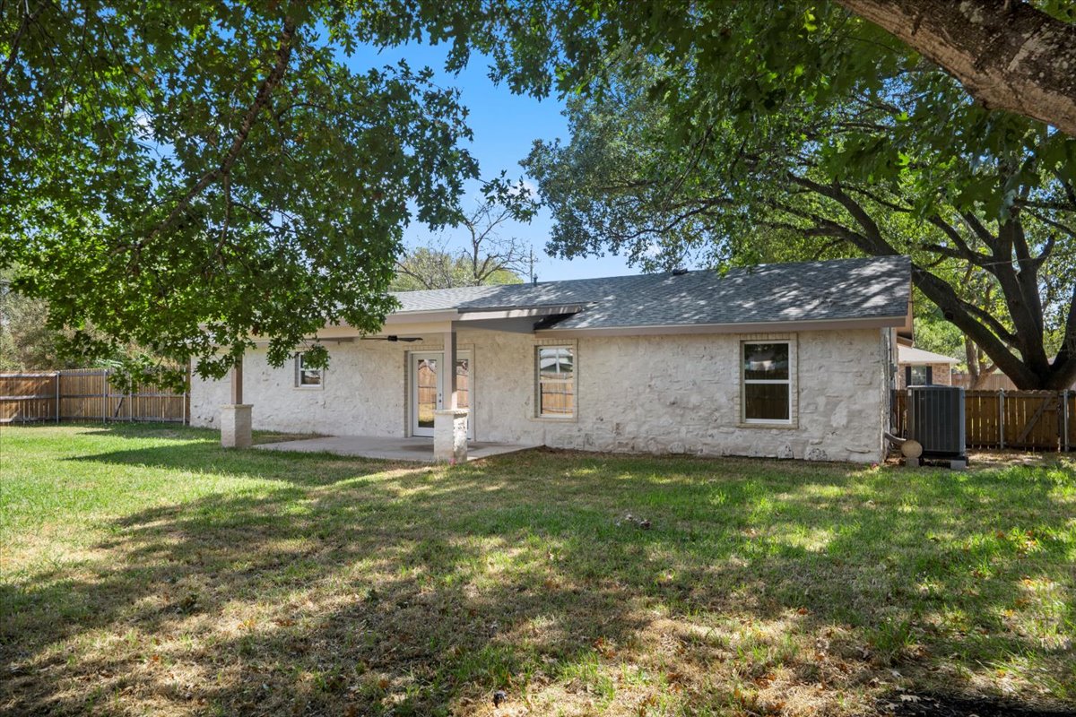 412 Oak Street Bastrop, TX 78602 - Photo 23 of 25 a front view of a house with a yard and trees