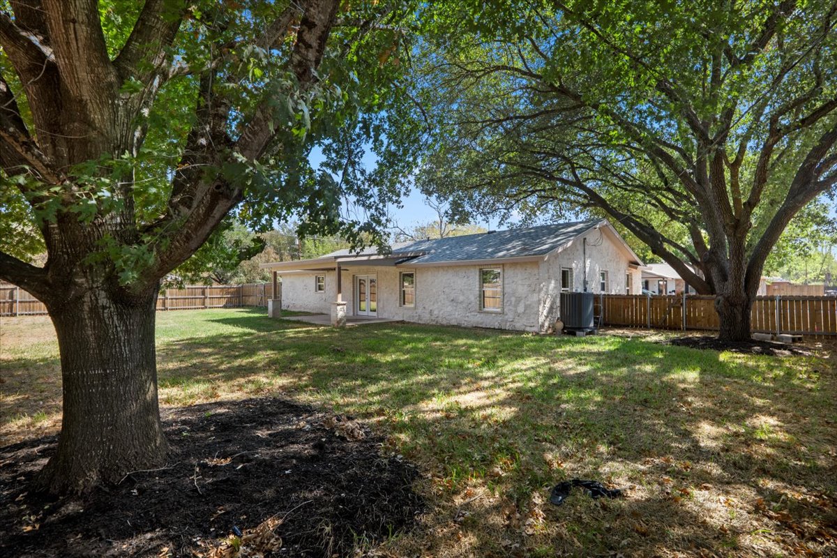 412 Oak Street Bastrop, TX 78602 - Photo 24 of 25 a view of a house with a tree in the yard