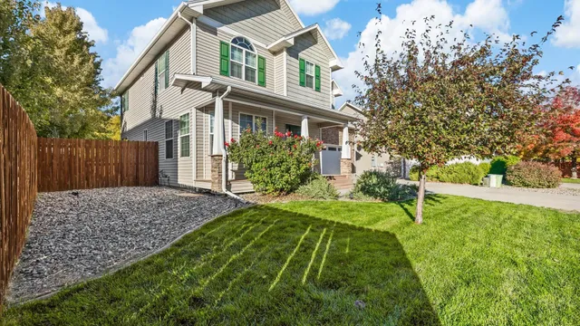 a front view of a house with a yard