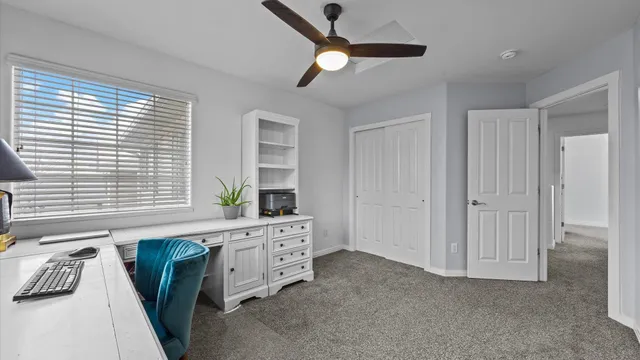 a spacious bedroom with a bed and a window