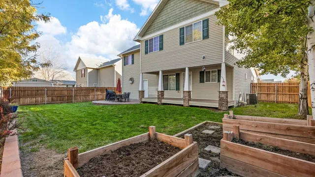 a view of a backyard with a garden and plants