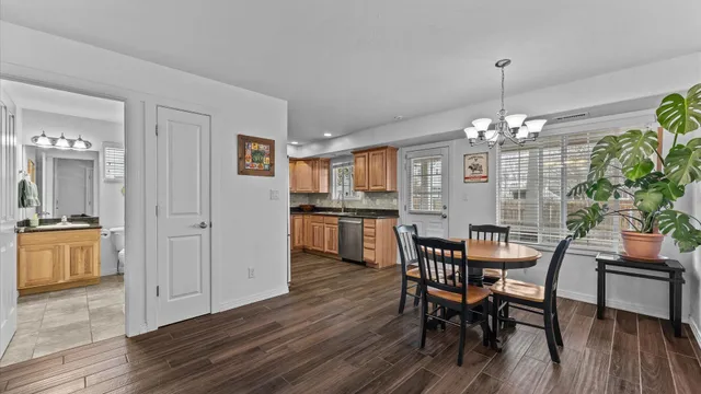 a view of a dining room with furniture and wooden floor