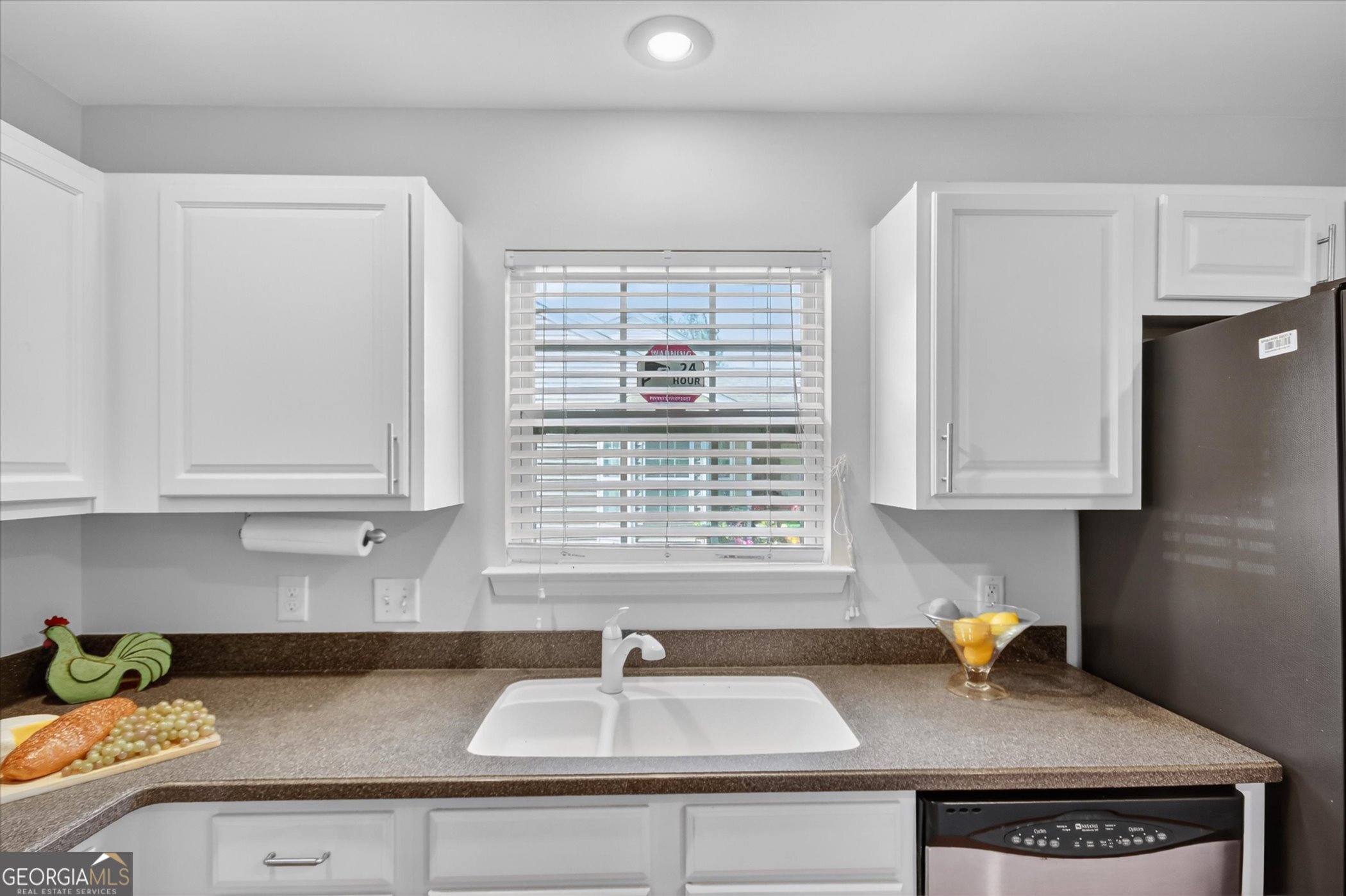 172 Sonata Circle Pooler, GA 31322 - Photo 20 of 85 a kitchen with stainless steel appliances granite countertop a sink a stove and a granite counter tops with white cabinets