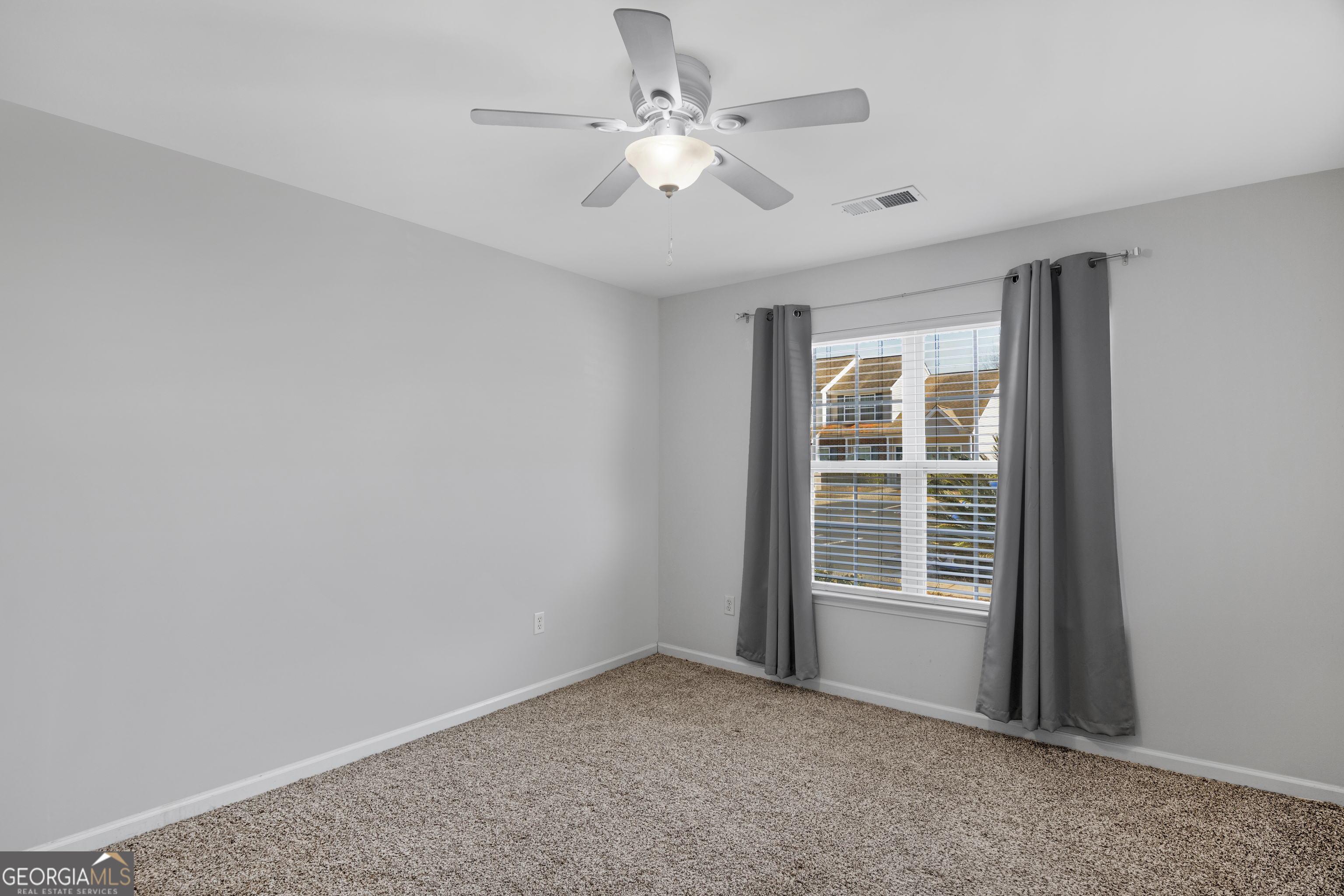 172 Sonata Circle Pooler, GA 31322 - Photo 35 of 85 an empty room with windows and ceiling fan