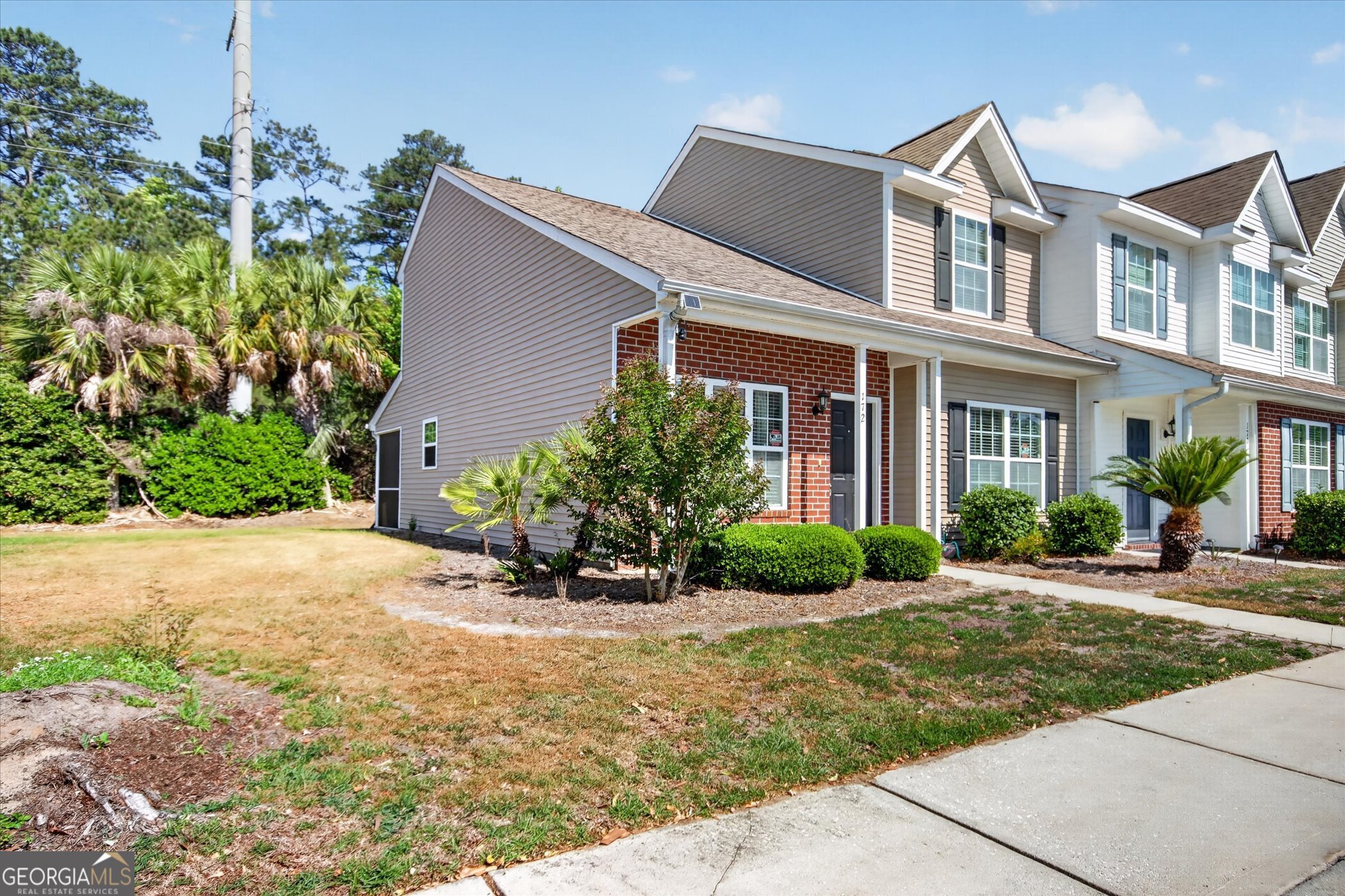 172 Sonata Circle Pooler, GA 31322 - Photo 4 of 85 a front view of a house with a yard and potted plants