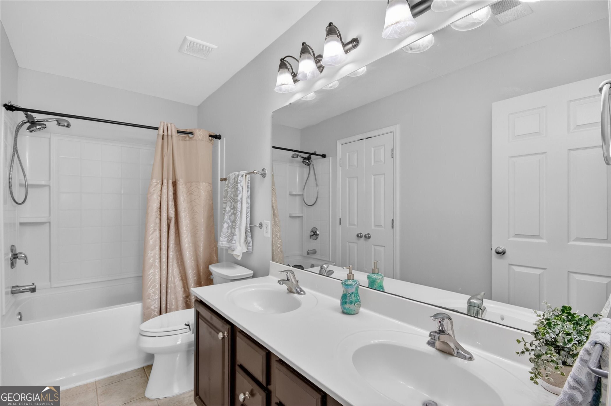 172 Sonata Circle Pooler, GA 31322 - Photo 44 of 85 a bathroom with a double vanity sink toilet and shower