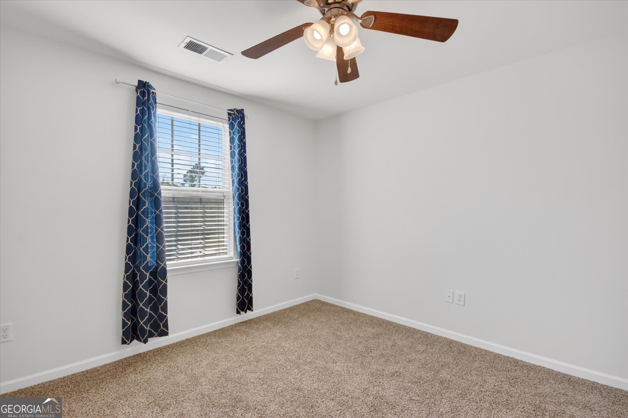 172 Sonata Circle Pooler, GA 31322 - Photo 48 of 85 an empty room with windows and fan