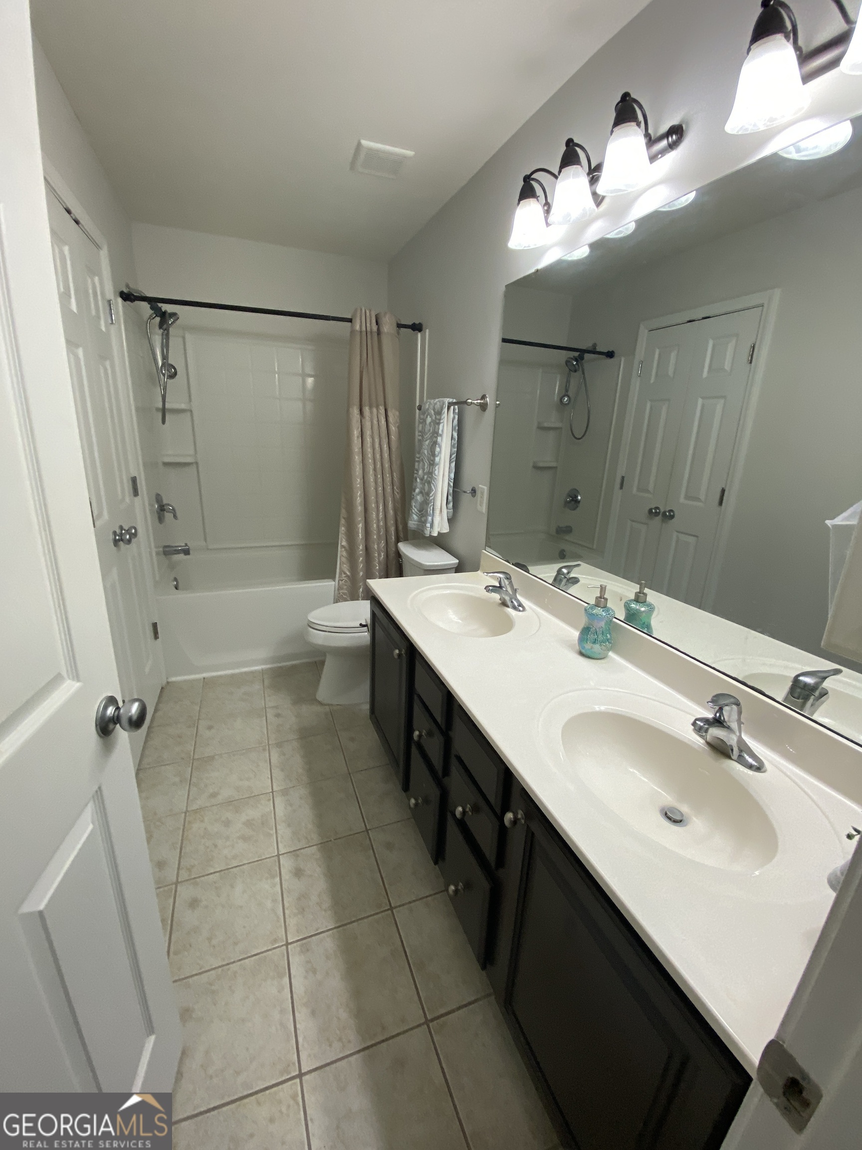 172 Sonata Circle Pooler, GA 31322 - Photo 60 of 85 a bathroom with a double vanity sink mirror and shower