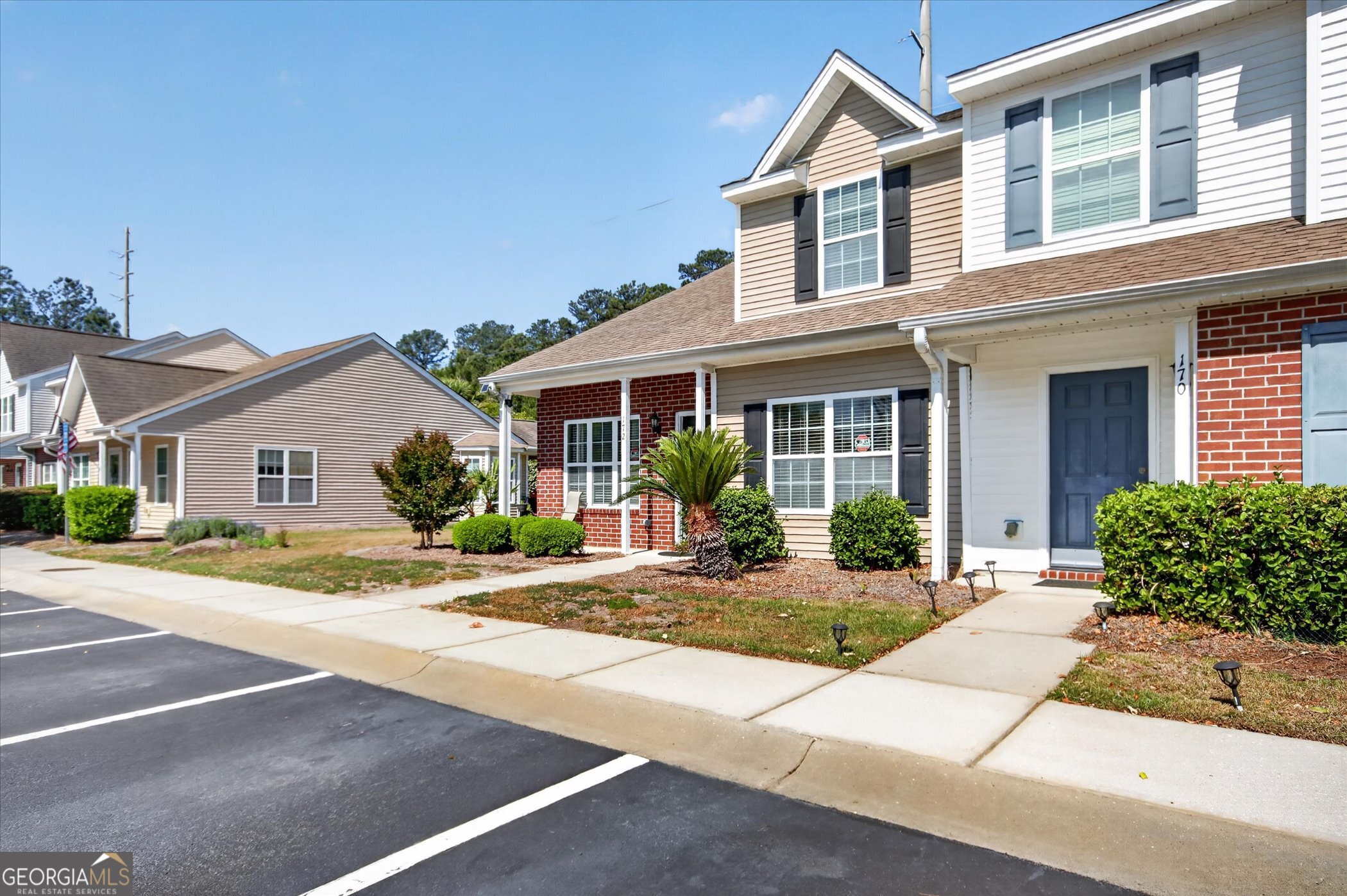 172 Sonata Circle Pooler, GA 31322 - Photo 6 of 85 a front view of a house with a yard and potted plants