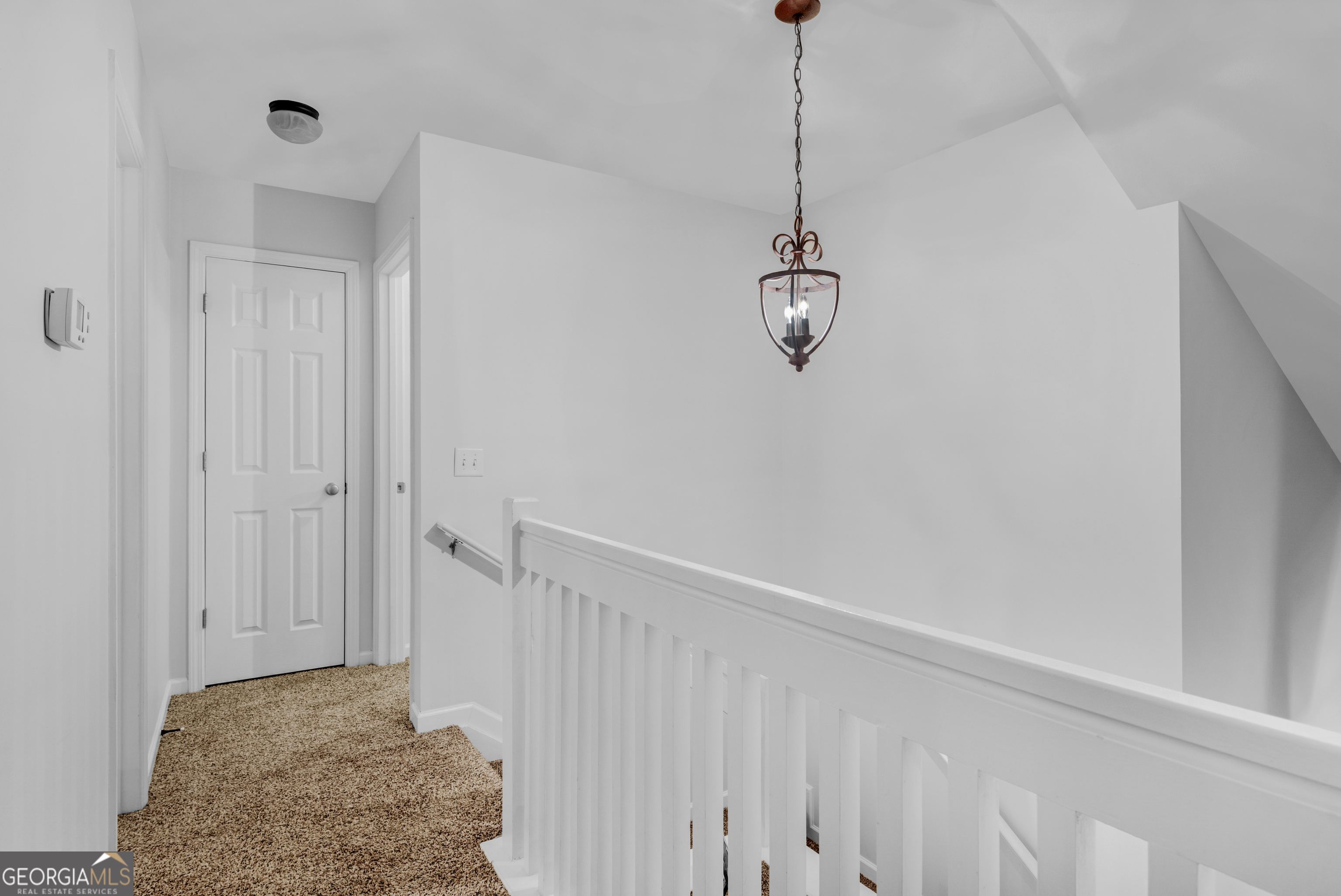 172 Sonata Circle Pooler, GA 31322 - Photo 83 of 85 a view of a hallway with chandelier fan and wooden floor